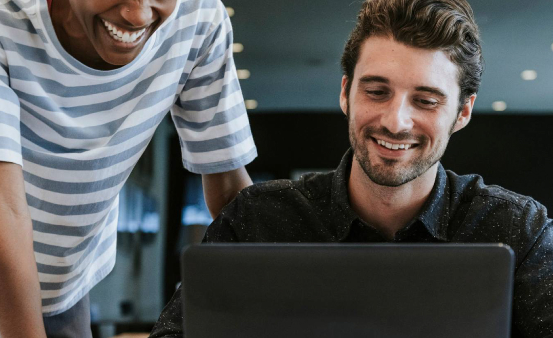 Man on Laptop reviewing financial dashboard